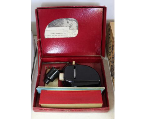 A boxed Eagle slide projector plus slides, this item is sold as a collectors item only and has not been subject to an electri