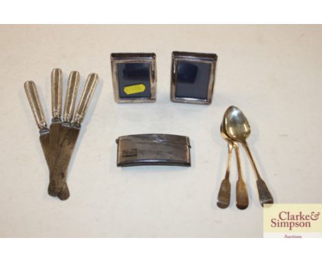 A silver engine turned card case; a pair of photograph frames; various cutlery etc