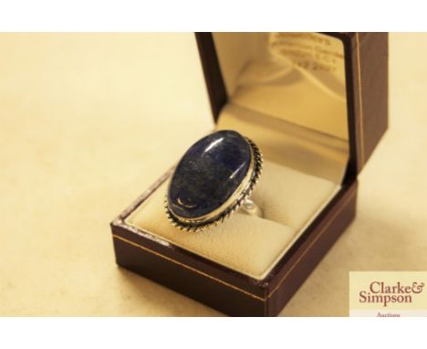 A white metal and lapis dress ring