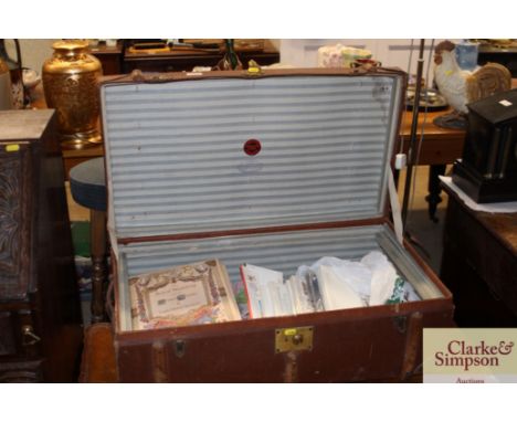 A vintage leather mounted and battened travelling trunk and contents of various First Day covers and stamps etc. 
