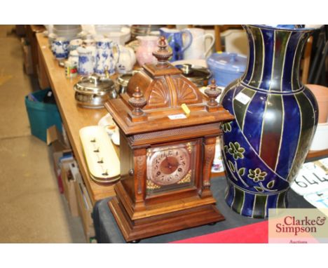 A Victorian walnut cased mantel clock