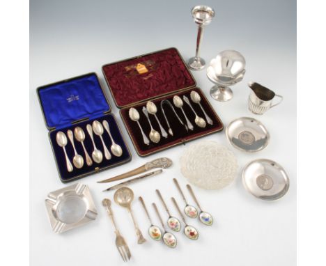 A lot of silver to include a bon bon dish, a posy vase, two Churchill coin dishes, an ash tray, a milk jug, a set of six enam