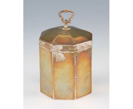 An Edwardian Mappin & Webb silver tea caddy, of octagonal form with gilt interior, with articulated scroll design handle, hal