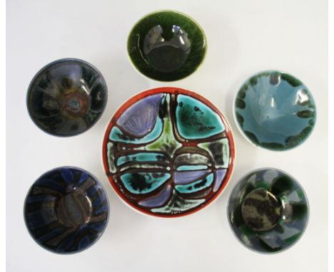 A group of six Poole pottery Delphis range bowls, five having assorted designs on blue and green grounds, with the larger bow