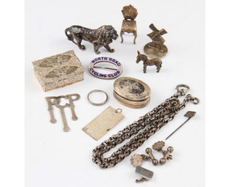 A lot of silver to include a Victorian Berthold Muller miniature chair, hallmarked London 1897, a model of a lion, a model of