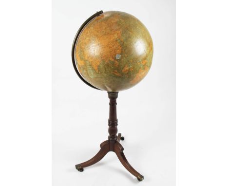 An early 20th Century floor standing globe on turned mahogany body with three splayed feet, globe A/F, height 120cm.