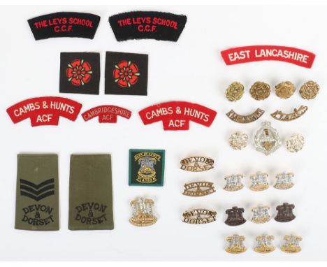 Grouping of Devon &amp; Dorsetshire Regiment Badges, including cap badges, collar badges, shoulder titles, rank slides etc; g