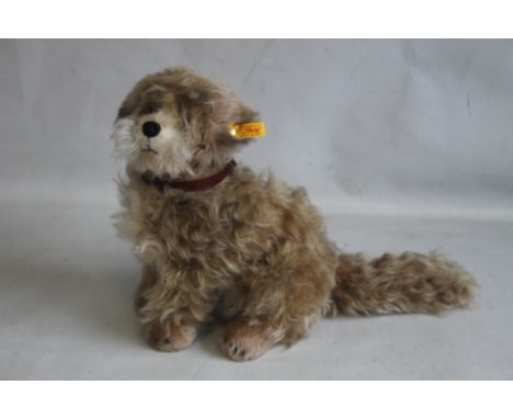 A STEIFF TREFF SKYE TERRIER PLUSH MOHAIR DOG, with button and tag to the ear H 30 cm