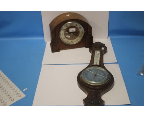 AN OAK MANTEL CLOCK AND A BAROMETER