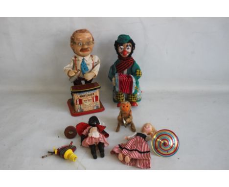 A 1950S/1960S JAPANESE AUTOMATON TOYS CONSISTING OF A MUSIC PLAYING HOBO AND MONKEY, and a Charles Weaver bartender along wit