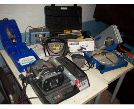 A SELECTION OF POWER TOOLS TO INCLUDE A BOXED DREMEL, A POWERED TILE CUTTER AND A CHOP SAW