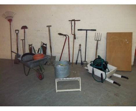 A SELECTION OF GARDEN TOOLS INCLUDING A WHEELBARROW ETC.