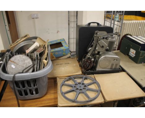 AN "AMPRO" 8MM FILM PROJECTOR IN ORIGINAL CARRY CASE, together with a quantity of film to include Bleak House,