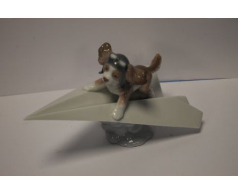 A LLADRO DOG ON AEROPLANE