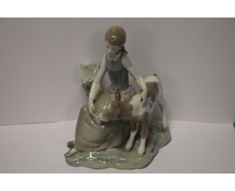 A LLADRO FIGURINE OF A GIRL AND CALF