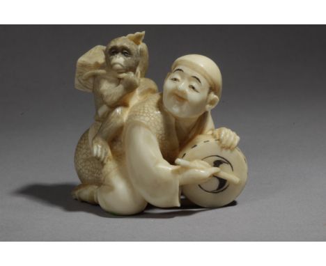 A late 19th century Japanese netsuke from Meiji period. Signed on the base. In carved elephant ivory depicting a kneeling 'Sa