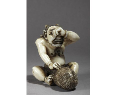 A 19th century Japanese netsuke from Meiji period. Signed on the back. In carved elephant ivory portraying a demon suffering 