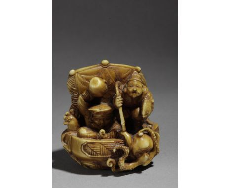 A late 19th century Japanese netsuke okimono from Meiji period. Signed Tomochika. In carved elephant ivory portraying a boat 