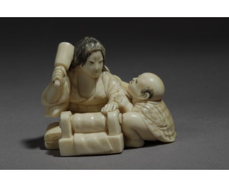  A mid 19th century Japanese netsuke from Edo period. Signed Sadamin. In carved elephant ivory portraying a laundress doing t