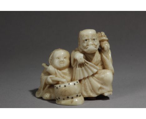 A mid 19th century Japanese netsuke from Edo period. Not signed. In carved elephant ivory portraying two kids. The standing o