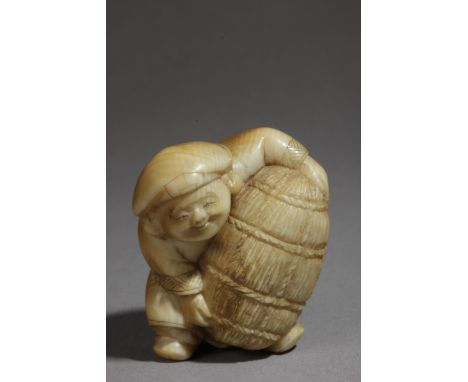 A 19th century Japanese netsuke. Signed Hozan. In carved elephant ivory portraying a standing Daikoku lifting a rice bundle, 