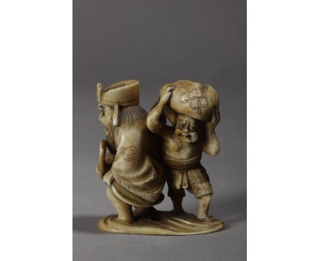 A 19th century Japanese netsuke from Edo period. Signed on the base. In carved ivory portraying a group composed by a standin