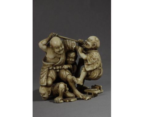 A mid 19th century Japanese netsuke from Edo period. Signed Shomin Con Kakihan. In carved ivory portraying a group of four ch