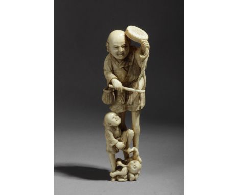 A late 19th century Japanese netsuke from Meiji period. Signed Gyokuzan. In carved elephant ivory portraying a group of tradi