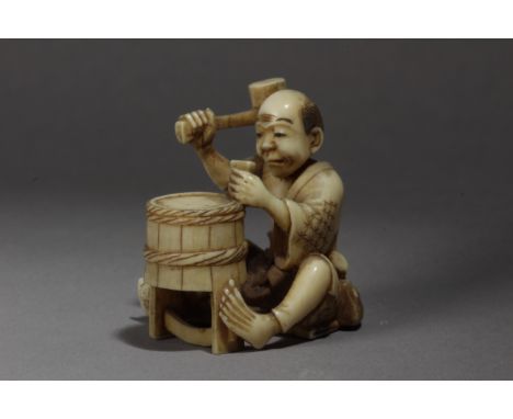 A 19th century Japanese netsuke. Not signed. In carved ivory portraying a craftsman building a water bucket. On the obi's lef