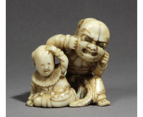 A mid 19th century Japanese netsuke from Edo period. Signed Tomochika. In carved elephant ivory portraying a child wearing a 