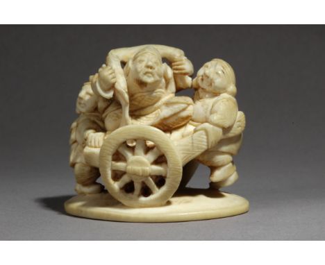 A late 19th century Japanese netsuke from Meiji period. Signed Akigyoku. In carved elephant ivory depicting a group of charac