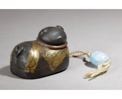 A 19th century Japanese netsuke-inro. Signed on the base. In carved wood and lacquer portraying a resting cat with a turquois