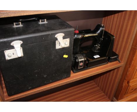 A Singer sewing machine (sold as collectors item)