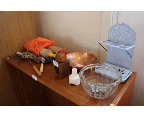 A quantity of silver plated cutlery; rolling pins; nut cracker; enamel stand etc
