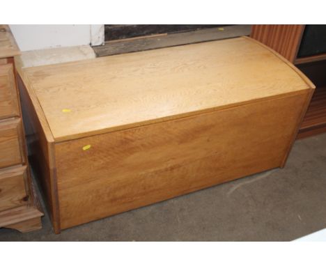A light oak blanket box
