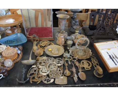 A quantity of metalware to include horse brasses, nut cracker in the form of a crocodile, vases etc.