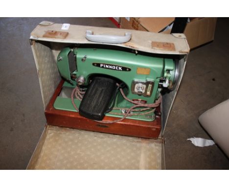 A Pinnock sewing machine (sold as collectors item)