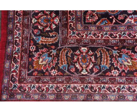 A large Caucasian multi coloured bordered carpet, 404 cm x 297 cm, modern