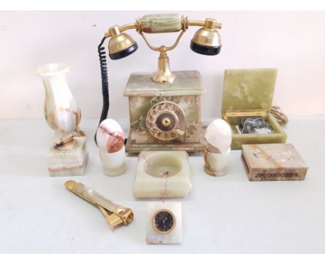 A collection of Onyx pieces to include a phone, two eggs in egg cups, two boxes, a clock, a cigar cutter, a vase, lighter and