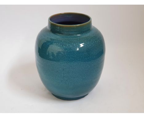 Blue mottled Poole Pottery vase. No condition report on this lot, Please View.