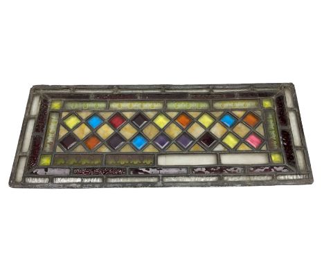 Stained glass and leaded rectangular window panel, with a Dimond pattern to the centre, H56cm, L22cm 