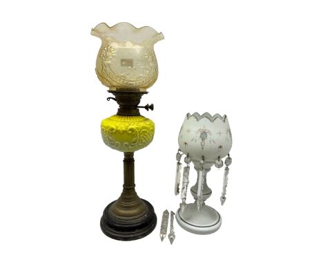 Victorian brass and yellow milk glass oil lamp, with moulded shade and reservoir, together with a white opaque glass lustre w
