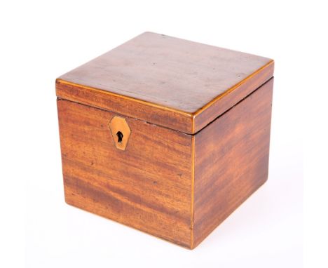 A SMALL GEORGE III MAHOGANY TEA CADDY, square, with inlaid escutcheon and complete with key. 11cm high, 12.5cm wide, 12.5cm d
