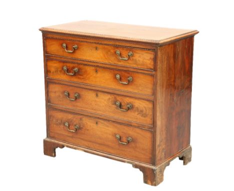 A GEORGE III MAHOGANY CHEST OF DRAWERS, the moulded rectangular cross-banded top above four long graduated drawers, each fitt