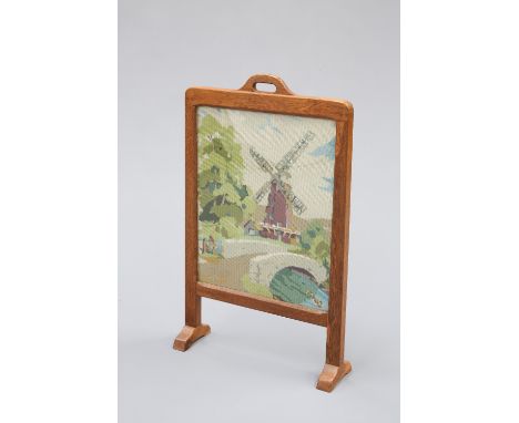SID POLLARDA YORKSHIRE OAK FIRESCREEN, CIRCA 1960, the chamfered surround with carrying handle, enclosing a woolwork picture 