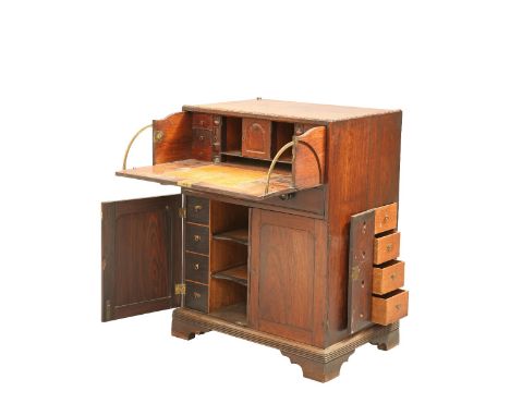 AN ANGLO-INDIAN ROSEWOOD SECRETAIRE CABINET, EARLY 19TH CENTURY, the deep drawer with fall front enclosing a leather writing 