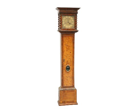 A WALNUT EIGHT-DAY LONGCASE CLOCK, the hood with fretwork and spiral columns, the 10 1/8-inch square brass dial, signed Henry