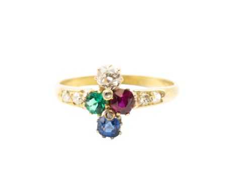 A MULTI GEM-SET RING The central quatrefoil, composed of a cushion-shaped sapphire, a similarly-cut ruby, a circular-cut emer