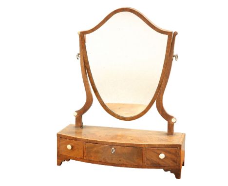 A GEORGE III MAHOGANY TOILET MIRROR,&nbsp;the cartouche-shaped mirror swivelling between uprights with axe-head handles, the 