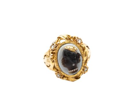 A LATE 19TH CENTURY BLACKAMOOR CAMEO RINGThe oval banded agate plaque, carved in relief to depict the profile of a female bla